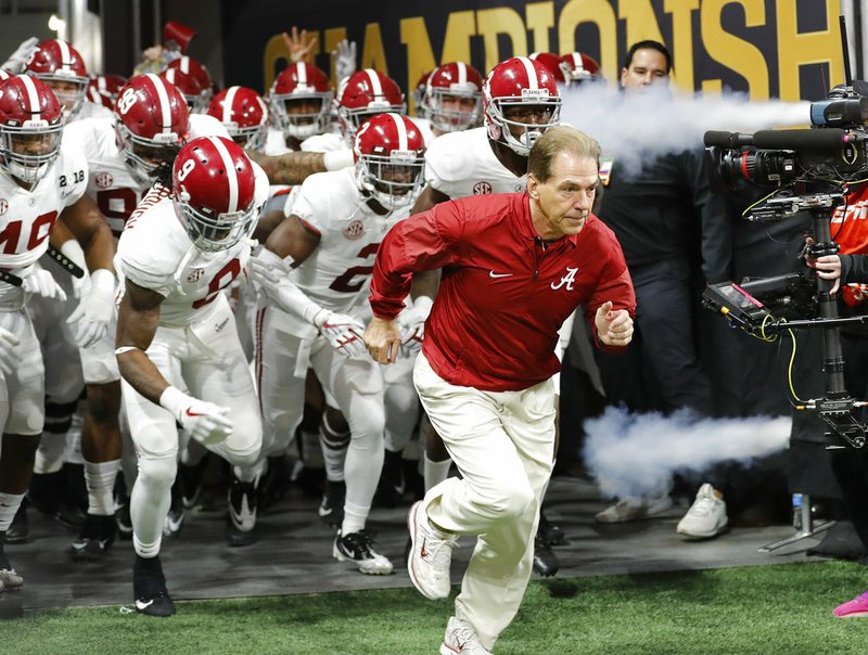 FILE - In this Jan. 8, 2018, file photo, Alabama head coach Nick Saban leads his team on the field before the NCAA college football playoff championship game against Georgia, in Atlanta. The AP preseason Top 25 is out, and for the third straight year Alabama is No. 1. (AP Photo/David Goldman, File)