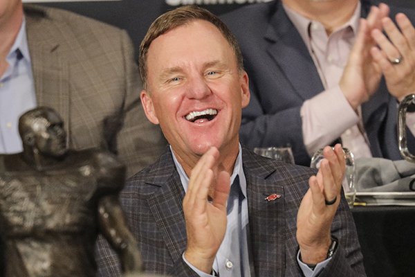 Arkansas coach Chad Morris laughs as he is introduced before speaking to the Little Rock Touchdown Club on Monday, Aug. 20, 2018, at Embassy Suites Hotel in Little Rock. 