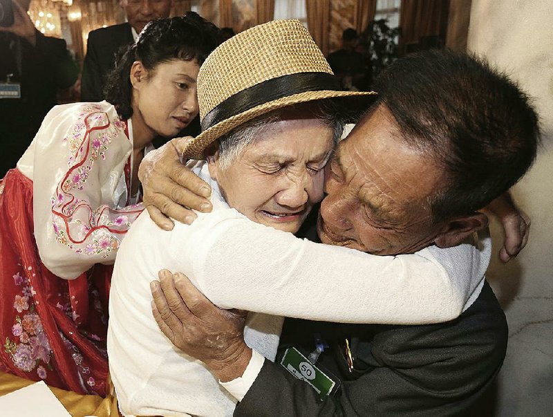 South Korean Lee Keum-seom, 92, weeps as she meets with her North Korean son Ri Sang Chol, 71, during the Separated Family Reunion Meeting at the Diamond Mountain resort Monday in North Korea.