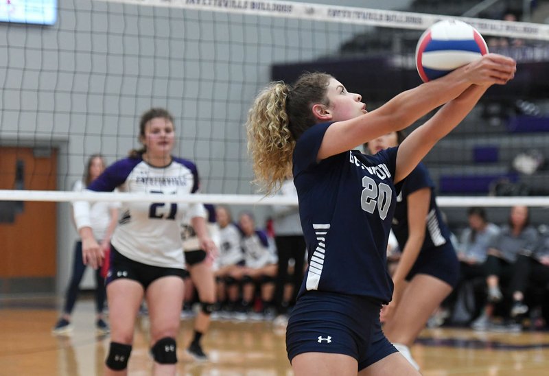 NWA Democrat-Gazette/J.T. WAMPLER Greenwood's Zoie Benton bumps the ball against Fayetteville Monday August 20, 2018. Greenwood won 25-21 in the fourth set to win the series 3-1.