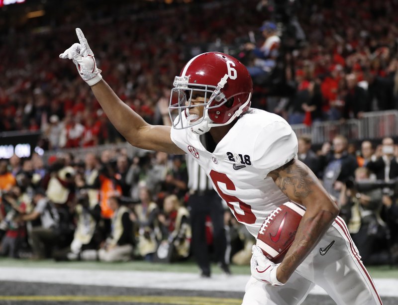 FILE - In this Jan. 8, 2018, file photo, Alabama wide receiver DeVonta Smith (6) celebrates his touchdown during overtime of the NCAA college football playoff championship game against Georgia, in Atlanta. The AP preseason Top 25 is out, and for the third straight year Alabama is No. 1. (AP Photo/David Goldman, File)