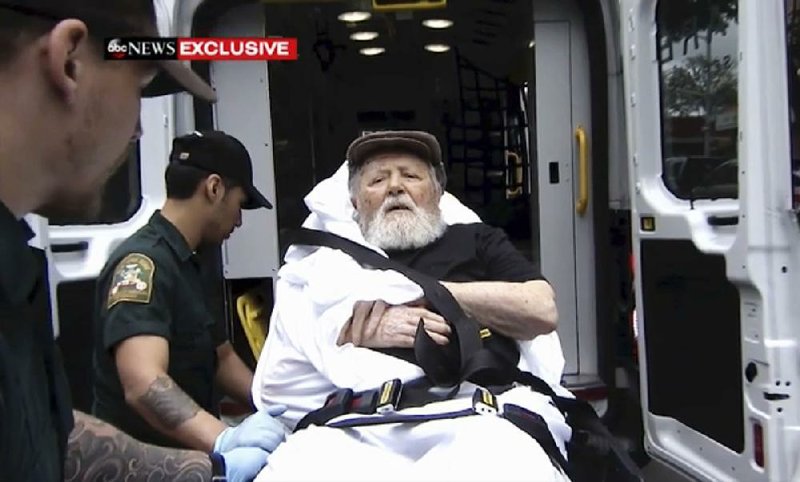 Jakiw Palij, a former Nazi concentration camp guard, is carried on a stretcher from his home Monday in the Queens borough of New York for deportation to Germany. 