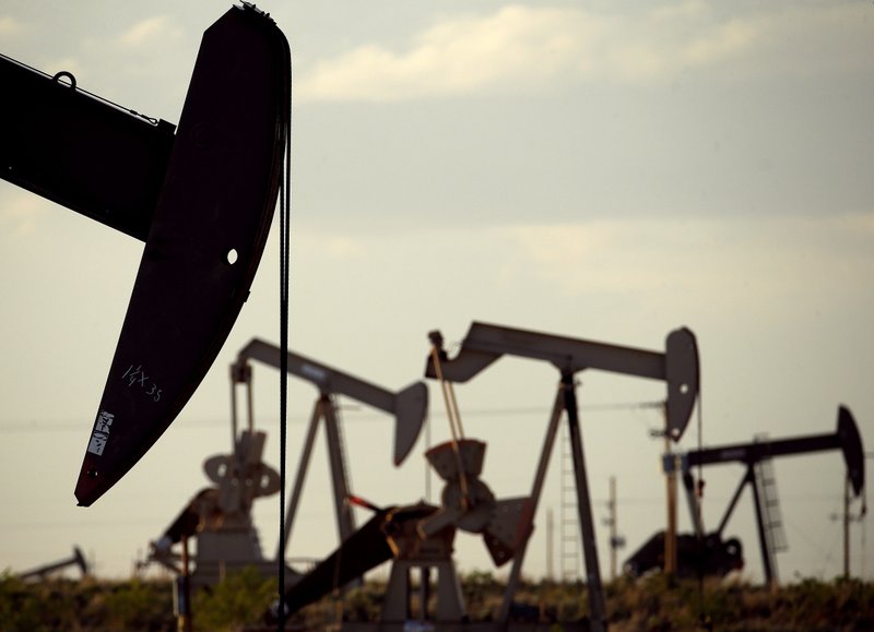 In this April 24, 2015 file photo, pumpjacks work in a field near Lovington, N.M. New Mexico Republican gubernatorial hopeful Steve Pearce is calling for a system of toll roads in southeastern New Mexico to serve booming oilfield and other commercial traffic around one of the most-productive oil and gas areas in the world. 