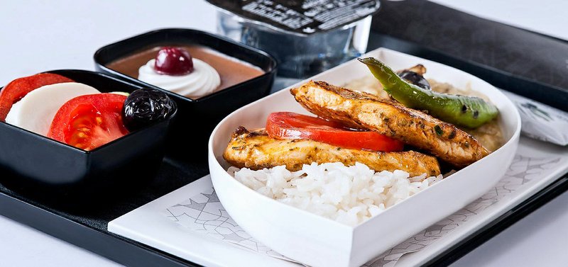 In a photo provided by Turkish Airlines, a gluten-free meal offered in economy class on Turkish Airlines: chicken breast over rice, with a caprese salad and chocolate mousse. Both international and domestic airlines report a rise in special meal requests in recent years, and many are trying to accommodate them by broadening their special meals categories. (Turkish Airlines via The New York Times)