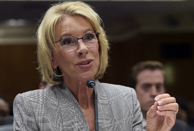 Education Secretary Betsy DeVos wants to use a provision in federal law to apply education grants toward weapons purchases for schools, several people say. 