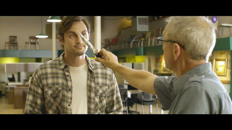 Blundale (Roger Scott) schools Walt (Andrew J. West) on the history of his beloved “Arkansas Toothpick” in a scene from Daniel Campbell’s Antiquities. 