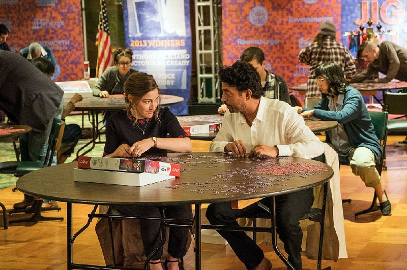 Agnes (Kelly Macdonald) and Robert (Irrfan Khan) discover things about themselves and each other when they become competitive puzzle working teammates in Marc Turtletaub’s gentle domestic drama Puzzle. 