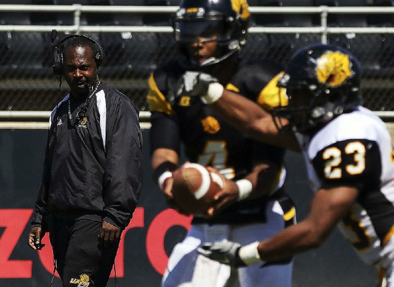 New UAPB Coach Cedric Thomas (left) said restoring the players’ confidence is his first step toward success. “The fact that out of seven games [in 2017], we were in every game. But you lose seven games,” he said. “Some of that’s on the kids. Not all of that’s on the kids. We control a lot of that. We control a lot of that." 