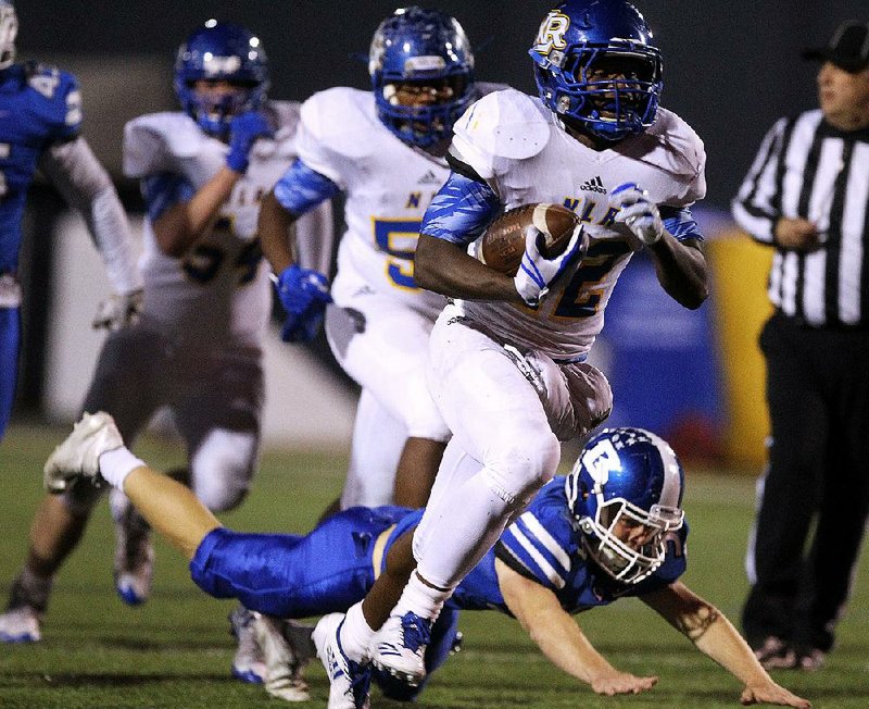 North Little Rock running back Brandon Thomas slips past Bryant linebacker Jake Wright for a touchdown Oct. 27 at Hornet Stadium in Bryant. Thomas, the Arkansas Democrat-Gazette’s All-Arkansas Preps Sophomore of the Year in 2017, rushed for 1,597 yards and 13 touchdowns on 209 carries last season.