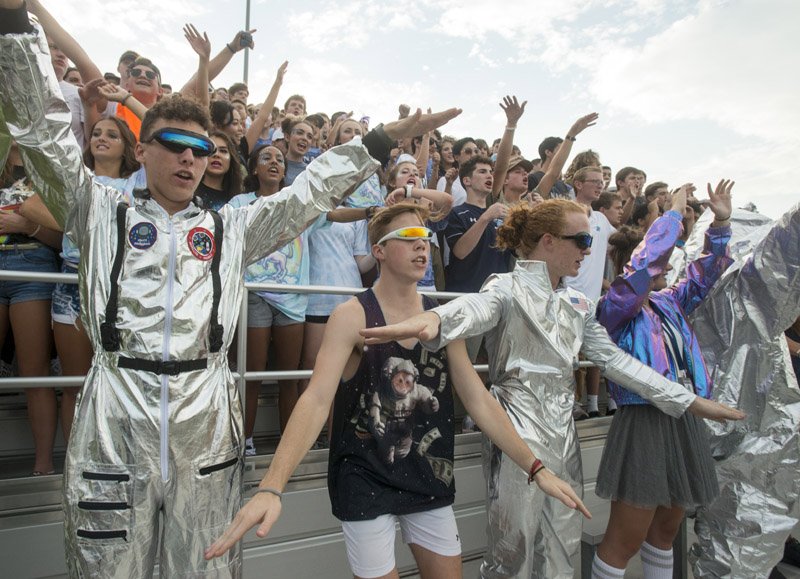 NWA Democrat-Gazette/BEN GOFF @NWABENGOFF The Springdale Har-Ber student section cheers while dressed for the theme 'Spaced Out' Friday during the game against Pulaski Academy at Wildcat Stadium in Springdale.
