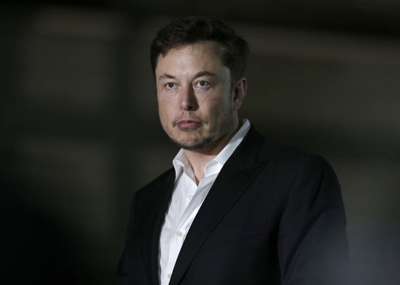 FILE- In this June 14, 2018, file photo, Tesla CEO and founder of the Boring Company Elon Musk speaks at a news conference in Chicago.  (AP Photo/Kiichiro Sato, File)