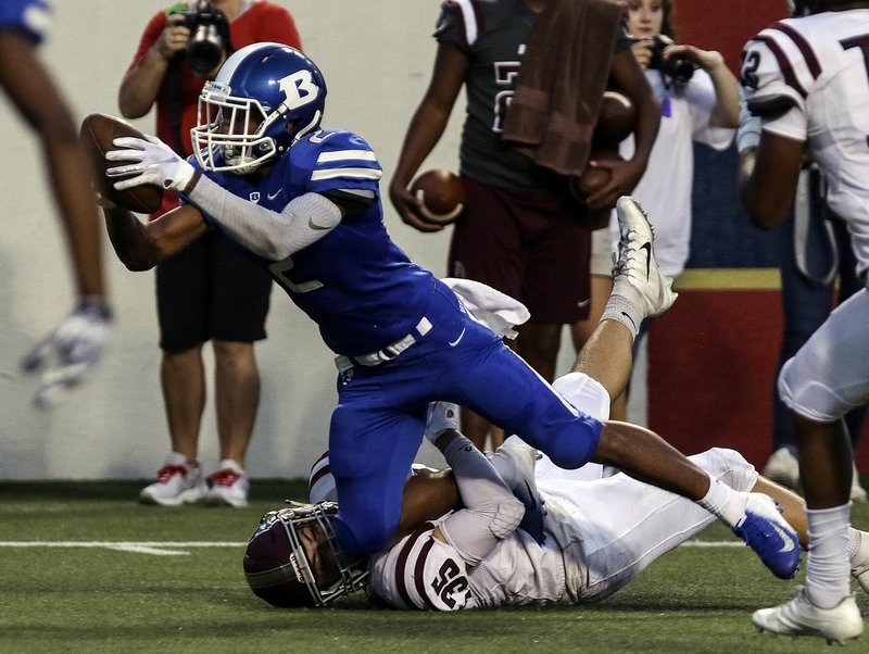 FILE — Bryant Andrew Hayes (2) dives for a touchdown during the Salt Bowl at War Memorial Stadium in Little Rock on Aug. 25, 2018.