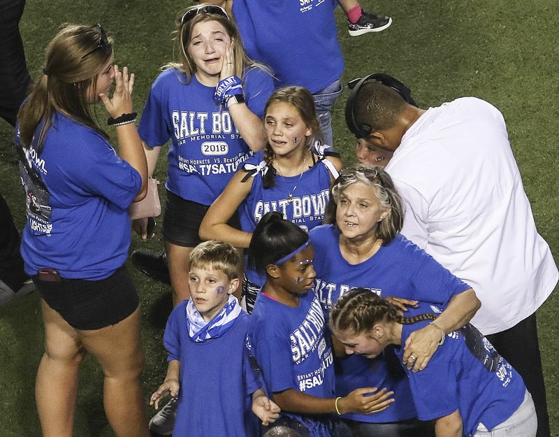 Arkansas Democrat-Gazette/MITCHELL PE MASILUN --7/25/2018-- People react after an incident during the Salt Bowl at War Memorial Stadium in Little Rock Saturday, August 25, 2018.