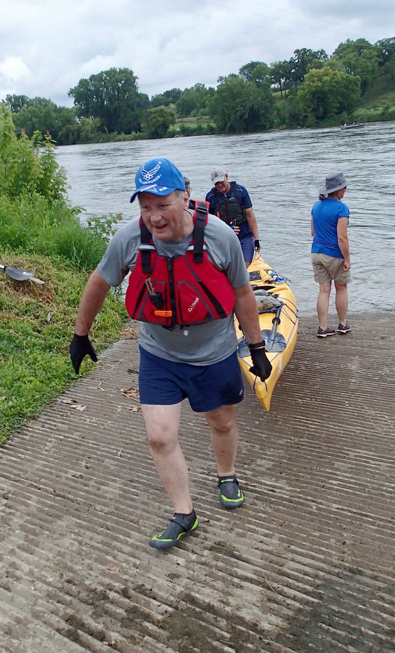 NWA Democrat-Gazette/FLIP PUTTHOFF The volunteer spirit is a big part of the trip. Paddlers help each other get their boats in and out of the water each day. Everyone who organizes and leads the trip is a volunteer.