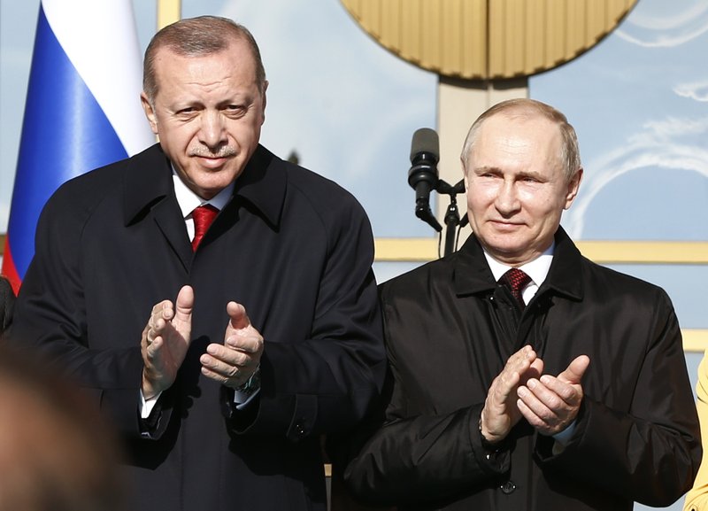 File-In this Tuesday, April 3, 2018 file photo, Turkey's President Recep Tayyip Erdogan left, and Russia's President Vladimir Putin, right, applaud during a welcome ceremony prior to their meeting at the Presidential Palace in Ankara, Turkey. Turkish-Russian relations are warming up, prompting worries in the West of a rift in the NATO alliance as Turkish and American officials spar over a detained American pastor. But Turkey may be seeking a more tactical relationship with Russia for now, mindful of the importance of its ties to the West and competing interests in its region. (AP Photo/Burhan Ozbilici, File)