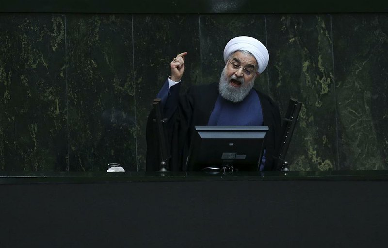 Iranian President Hassan Rouhani speaks Tuesday at a parliamentary session in Tehran after lawmakers ordered him to appear for questioning.  