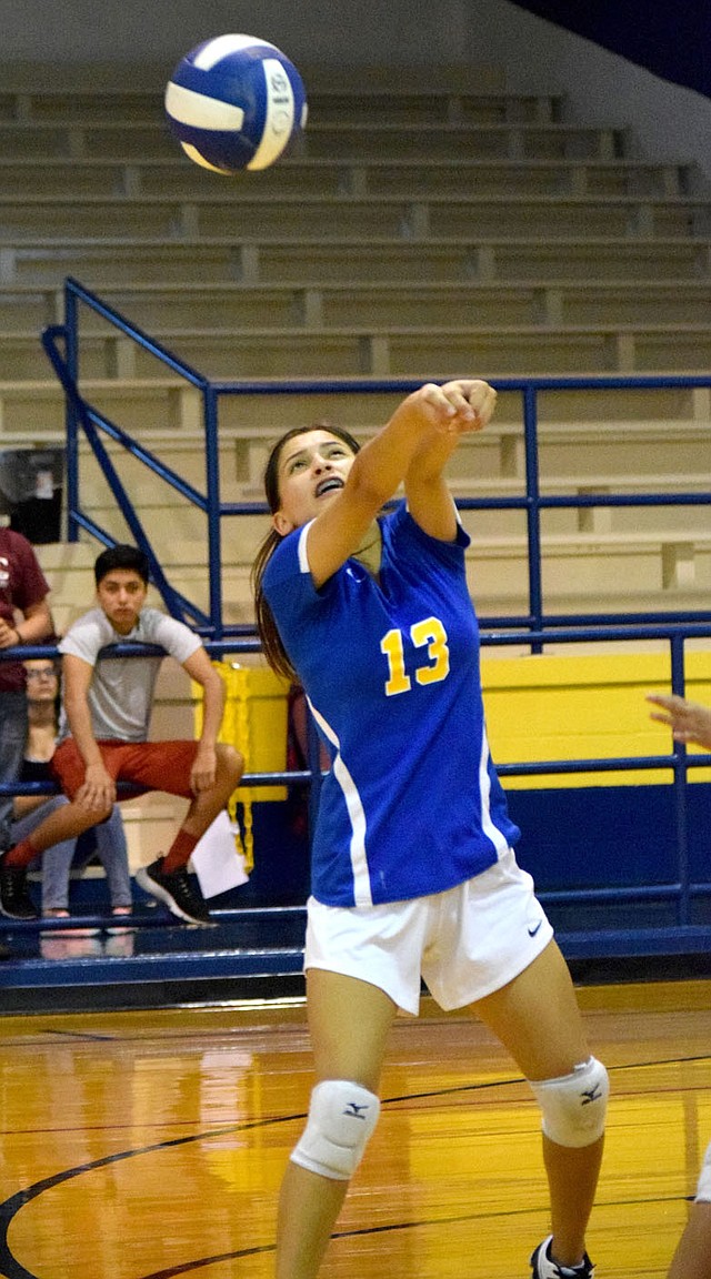 Westside Eagle Observer/MIKE ECKELS On the third contact, Lady Bulldog Ithzel Martinez puts forth extra effort to send the ball over the net into Lady Leopard's territory during the second set of the Decatur-Alpena varsity volleyball match at Peterson Gym Aug. 23.