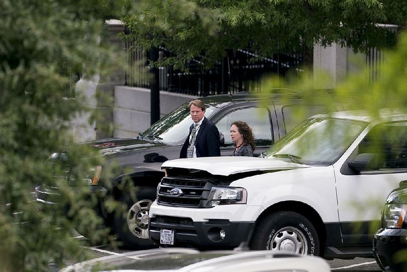 White House counsel Don McGahn heads toward the West Wing of the White House on Wednesday.  