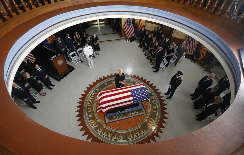 Cindy McCain, wife of, Sen. John McCain, R-Ariz. stands at the casket during a memorial service at the Arizona Capitol on Wednesday, Aug. 29, 2018, in Phoenix. (AP Photo/Ross D. Franklin, Pool)