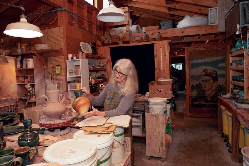 Becki Dahlstedt holds an original piece of pottery. Dahlstedt and her husband, David, create functional pottery in Mountain View. Becki is the founder and organizer of the Off the Beaten Path Studio Tour that will take place Sept. 14-16.