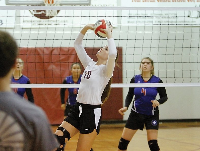 Terrance Armstard/News-Times West Side Christian's Anna Williams makes a play during the Lady Warriors' volleyball match against Garrett Memorial Thursday night. The Lady Warriors won in straight sets.