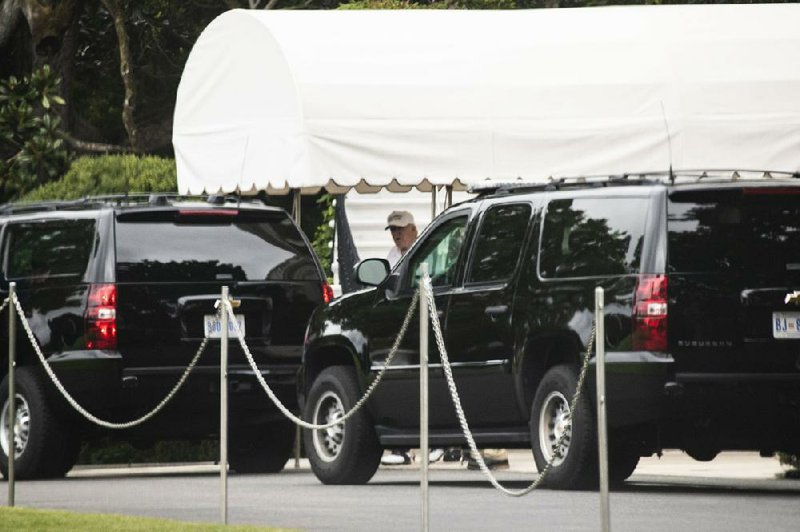 President Donald Trump boards his motorcade Saturday at the White House en route to his golf course in Sterling, Va., shortly after tweeting a threat to end the North American Free Trade Agreement over differences with Canada. 
