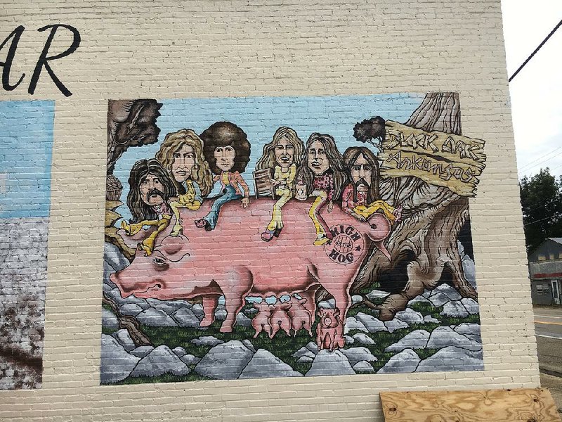 Murals of the band Black Oak Arkansas are on the building that will house the town museum. 