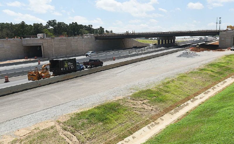 Traffic moves through a work zone last week on Interstate 49 in Bentonville near Northwest Arkansas Community College.