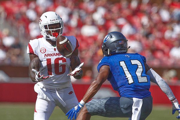 Arkansas receiver La'Michael Pettway brings in a pass in front of Eastern Illinois defensive back Dysaun Smith during a game Saturday, Sept. 1, 2018, in Fayetteville. 