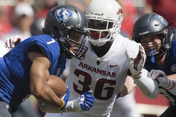Arkansas defensive back D'Vone McClure (36) pursues Eastern Illinois receiver Aaron Gooch (7) during a game Saturday, Sept. 1, 2018, in Fayetteville.