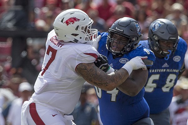 Arkansas defensive lineman Briston Guidry (7) is blocked by Eastern Illinois offensive lineman Johari Branch (64) during a game Saturday, Sept. 1, 2018, in Fayetteville. 
