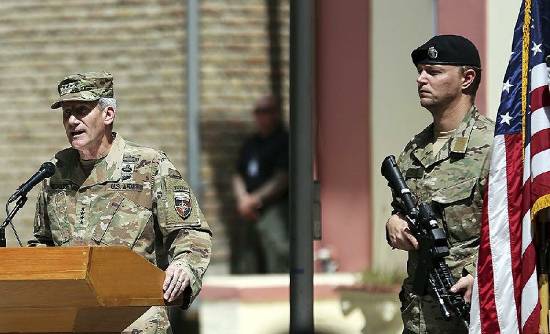 U.S. Army Gen. John Nicholson (left) speaks at a change-of-command ceremony Sunday in Kabul as he wraps up his tenure as leader of NATO’s Afghanistan mission. 