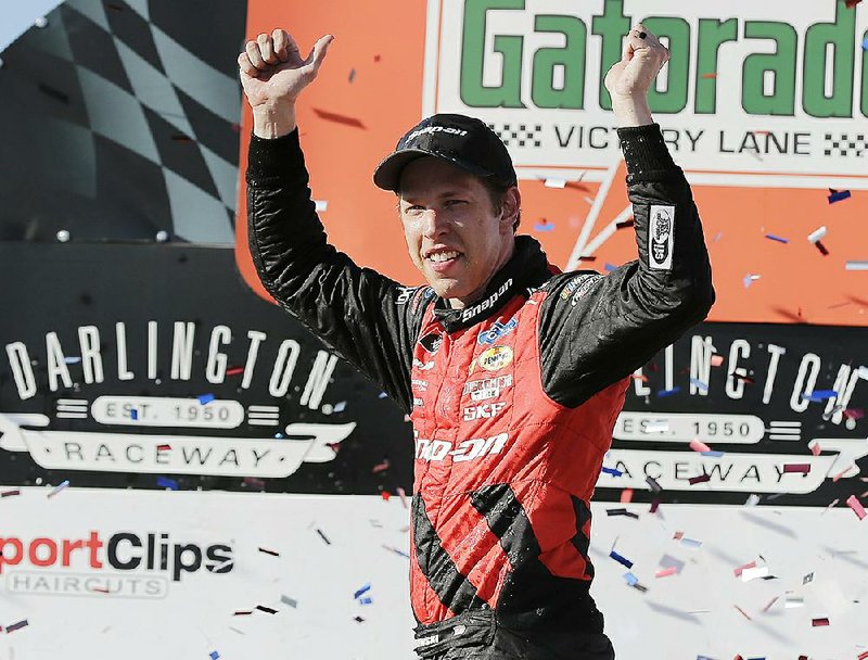 Brad Keselowski celebrates in Victory Lane after winning the NASCAR Xfinity Series auto race at Darlington Raceway, Saturday, Sept. 1, 2018, in Darlington, S.C.