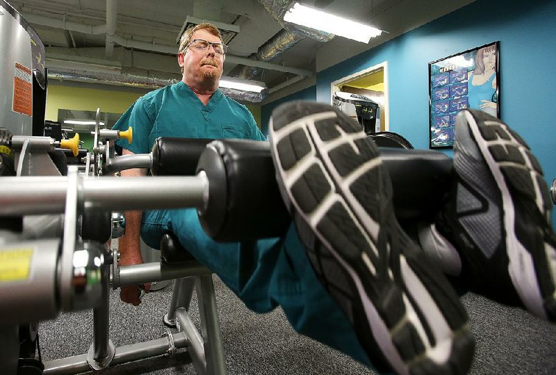 Dr. Todd Maxson works out at Arkansas Children’s Hospital on Thursday. Maxson helped create the state’s trauma system.