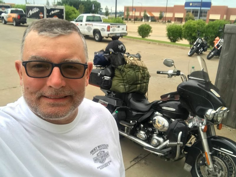 Courtesy photo Rick McLeod of Rogers finished the Hoka Hey Motorcycle Challenge, traveling 10,000 miles through 27 states in 12 days. Not only did he complete the challenge, he finished in the top 20 among 130 riders. Here McLeod stands next to his 2013 Harley-Davidson motorcycle.