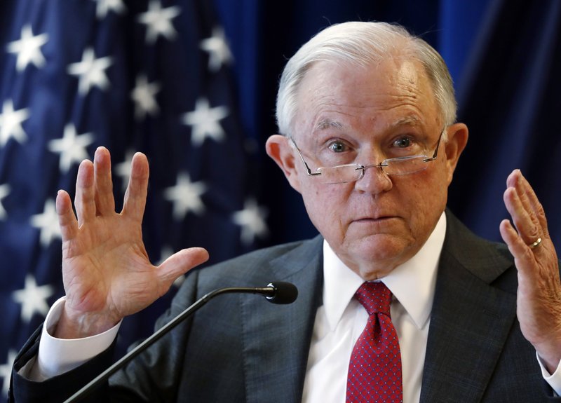 In this July 13, 2018 photo, Attorney General Jeff Sessions delivers remarks in Portland, Maine. President Donald Trump is escalating his attacks on Attorney General Jeff Sessions, suggesting the embattled official should have intervened in investigations of two GOP congressmen to help Republicans in the midterms. Trump tweeted Monday that &#x201c;investigations of two very popular Republican Congressmen were brought to a well publicized charge, just ahead of the Mid-Terms, by the Jeff Sessions Justice Department.&#x201d; (AP Photo/Robert F. Bukaty)