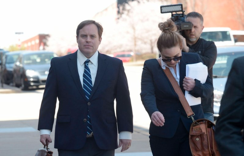 FILE PHOTO: Former state Sen. Jon Woods (left) walks April 4 alongside his attorneys outside the John Paul Hammerschmidt Federal Building in Fayetteville.