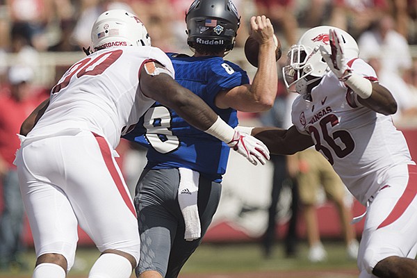 Arkansas Razorbacks defenders sack Eastern Illinois Panthers quarterback Harry Woodbery (8) in the end zone resulting in a touchdown during a football game, Saturday, September 1, 2018 at Razorback Stadium in Fayetteville.