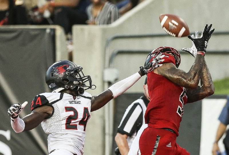 Arkansas State wide receiver Kendrick Edwards (right) catches a 36-yard touchdown pass from Justice Hansen during Saturday’s 48-21 victory over Southeast Missouri State. This week, the Red Wolves face top-ranked Alabama.