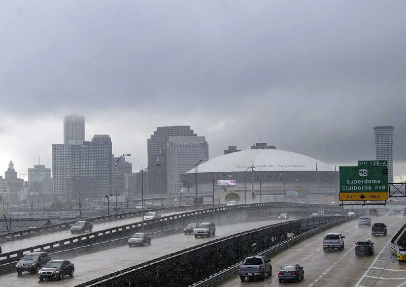 Rain and heavy clouds move Tuesday into New Orleans ahead of Tropical Storm Gordon. 