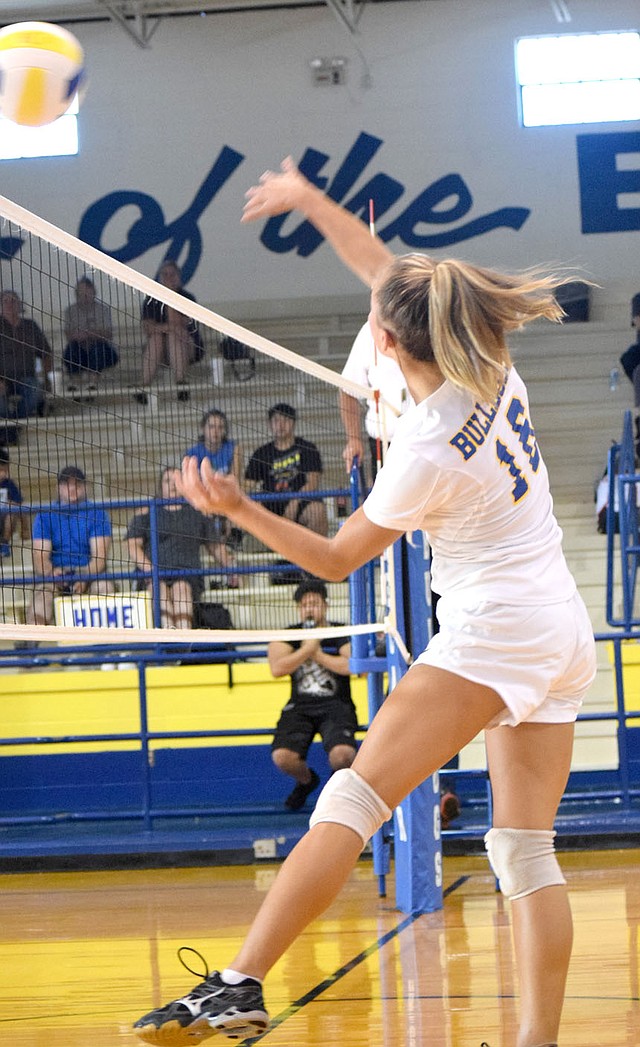 Westside Eagle Observer/MIKE ECKELS Destiny Mejia (Bulldogs 16) puts power behind a hit, sending the ball well into Lady Warrior territory during the Decatur-Life Way Christian volleyball contest in Decatur Aug. 28.