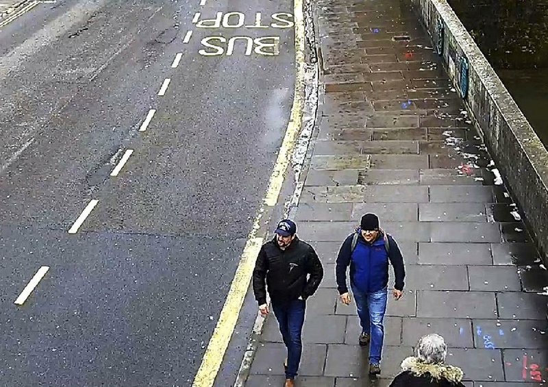 An image taken from CCTV and issued Wednesday by the Metropolitan Police in London shows Ruslan Boshirov (left) and Alexander Petrov in Salisbury, England, on March 4. The two Russians are suspects in the poisoning of a former Russian spy and his daughter. 