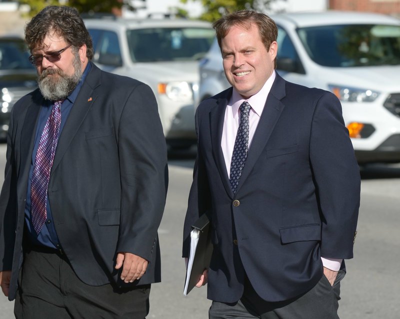 Former state Sen. Jon Woods (right) heads to federal court Wednesday in Fayetteville for sentencing on corruption charges.