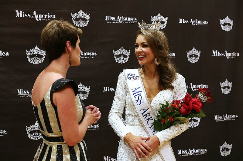 Claudia Raffo of Jonesboro (right), Miss Arkansas 2018, chats with Miss America board of trustees member Jessie Bennett after Raffo’s win in the Miss Arkansas Pageant in June. Raffo will compete for the Miss America crown on ABC tonight. 
