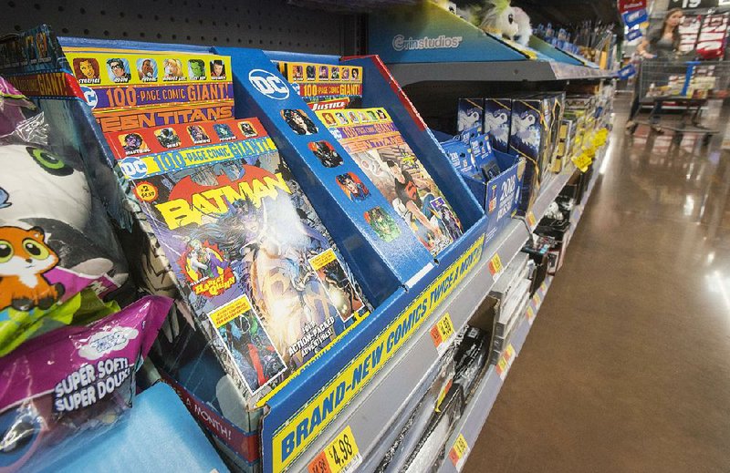 A series of 100-page anthology comic books featuring popular DC Comics superheroes is displayed at the Walmart Supercenter on Pleasant Crossing Boulevard in Rogers.  