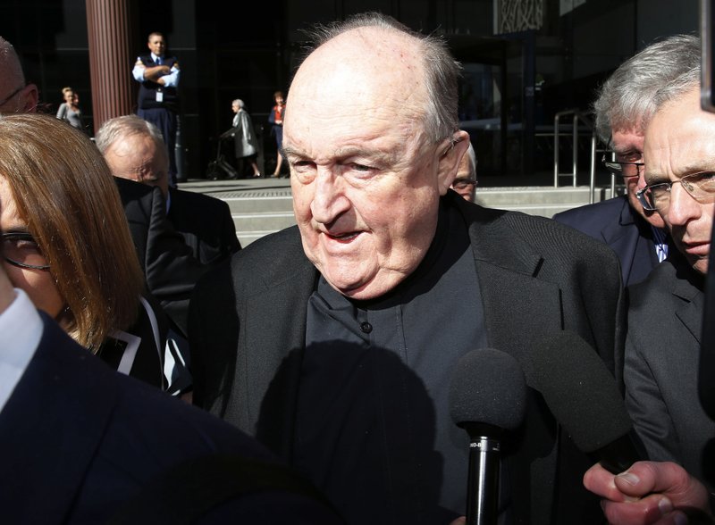 FILE - In this Aug. 14, 2018, former Adelaide Archbishop Philip Wilson leaves Newcastle Local Court, in Newcastle, Australia, after a post-sentence decision. Australian prosecutors are appealing for a tougher sentence for Wilson convicted of covering up child sex abuse. Wilson was to be detained at his sister's house for at least six months of a one-year sentence before he is eligible for parole. (Darren Pateman/AAP Image via AP, File)