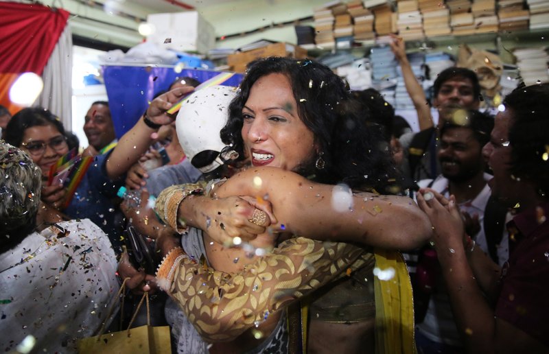 Supporters and members of the LGBT community celebrate after the country's top court struck down a colonial-era law that makes homosexual acts punishable by up to 10 years in prison, in Mumbai, India, Thursday, Sept. 6, 2018. The court gave its ruling Thursday on a petition filed by five people who challenged the law, saying they are living in fear of being harassed and prosecuted by police. (AP Photo/Rafiq Maqbool)