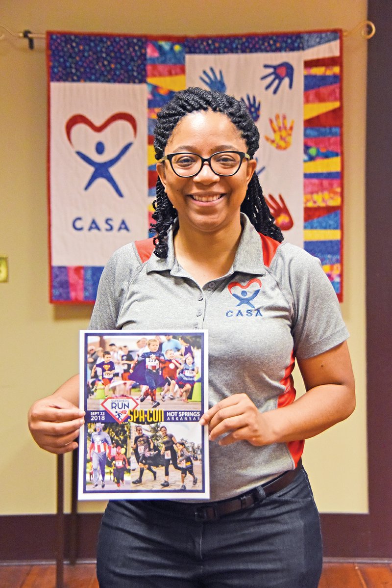 The Tri-Lakes Court Appointed Special Advocates will host its first Superhero Fun Run on Sept. 22, starting at the Hot Springs Convention Center. Executive director Desternie Sullivan, who is posing with a flyer for the run, said she has had a passion for kids ever since she one. 