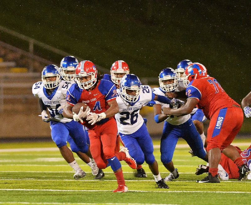 Little Rock McClellan running back Jeremiah Aikins (24) rushed for 110 yards on 13 carries and scored 2 touchdowns in the Lions’ 34-14 victory over Sylvan Hills on Friday night. 