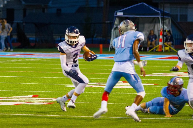 Special to the NWA Democrat-Gazette/MARK STALLINGS Luke Leonard (2) of Greenwood breaks a tackle Friday and looks down field against Southside's defense in Fort Smith.